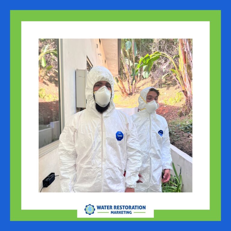 Two people in protective gear outdoors.