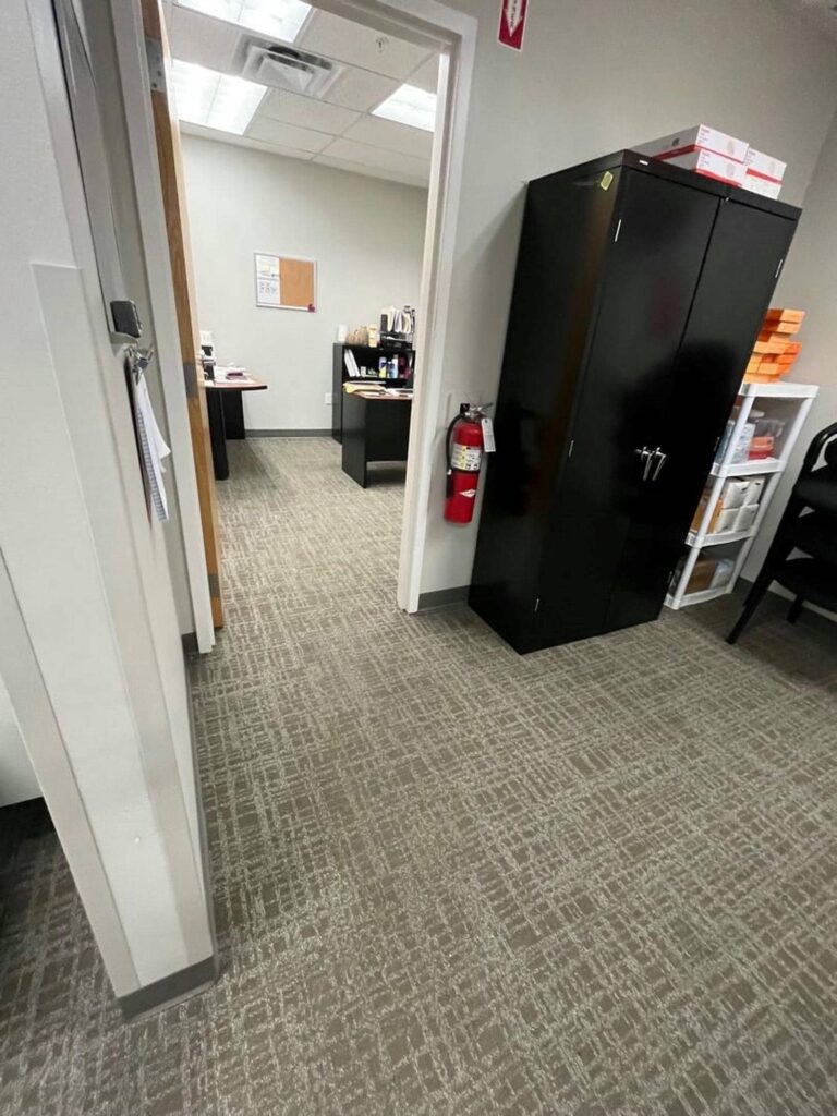 Office hallway with storage cabinet visible.