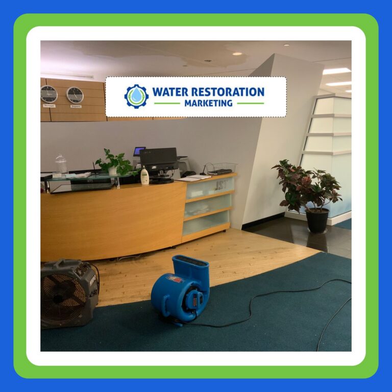 Office with water restoration equipment visible.