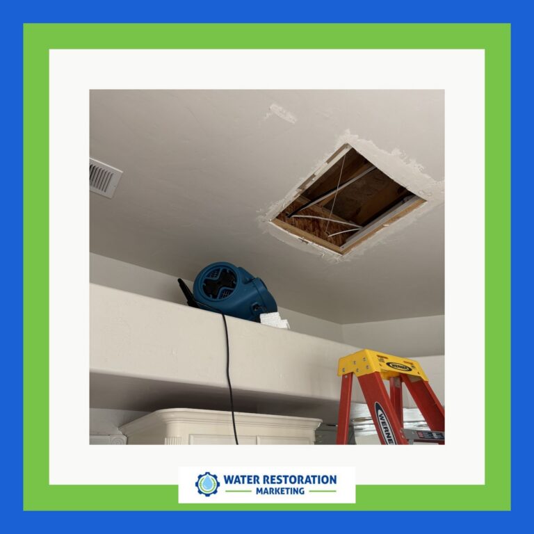 Ceiling repair with fan and ladder.