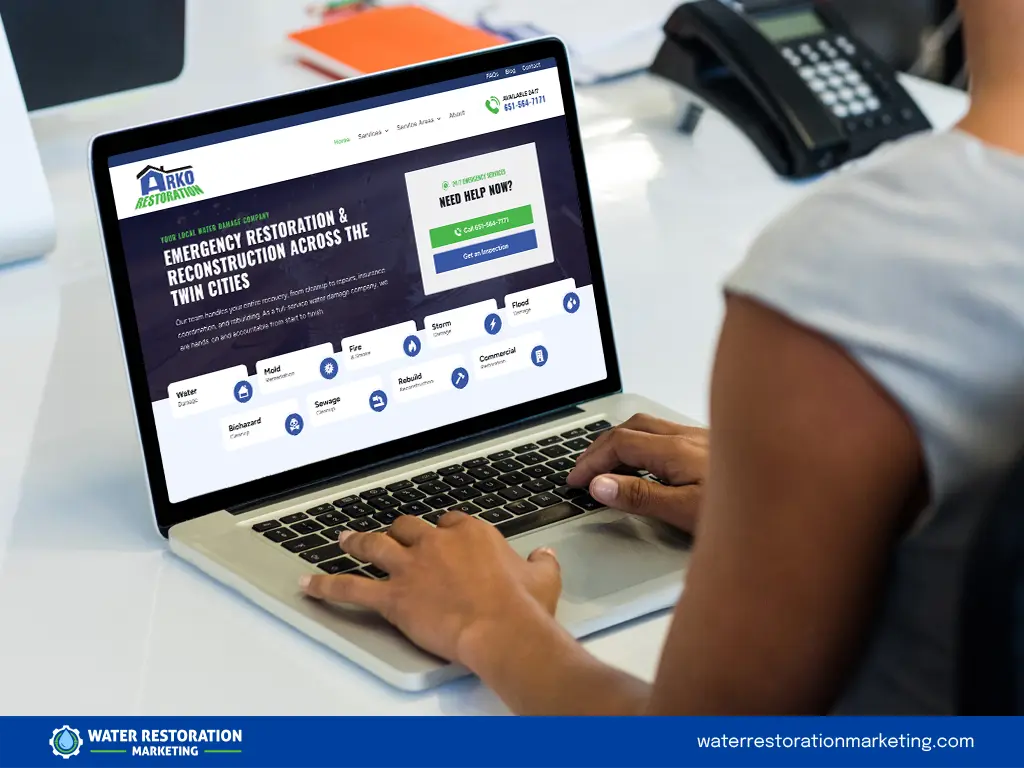 Laptop on a table with client's website homepage pulled up