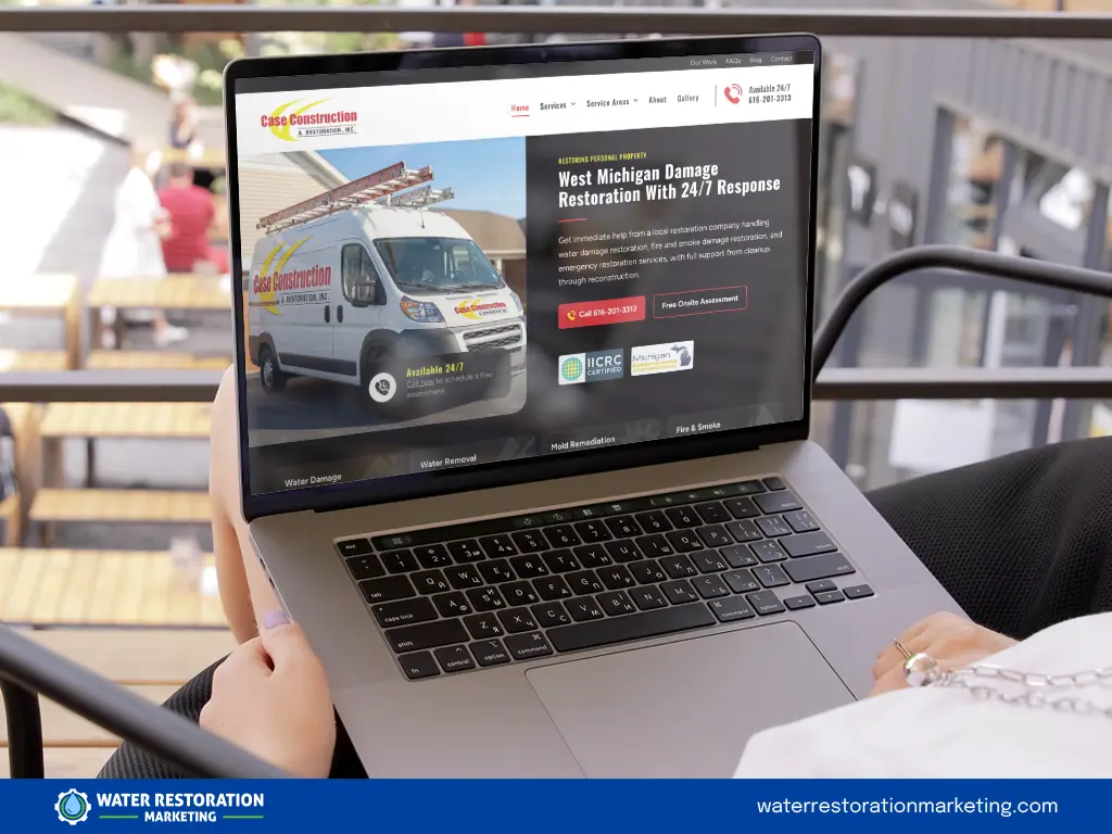 Laptop on a table with client's website homepage pulled up