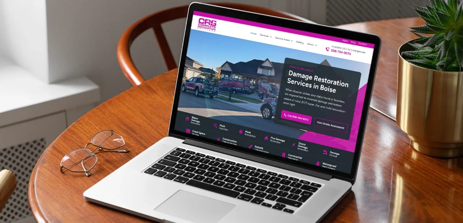 Laptop screen showing disaster restoration websites