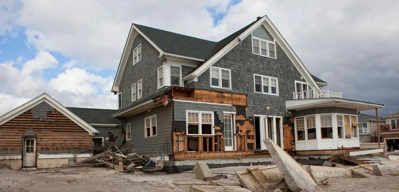 Exterior view of hurricane damaged house from disaster restoration marketing campaign