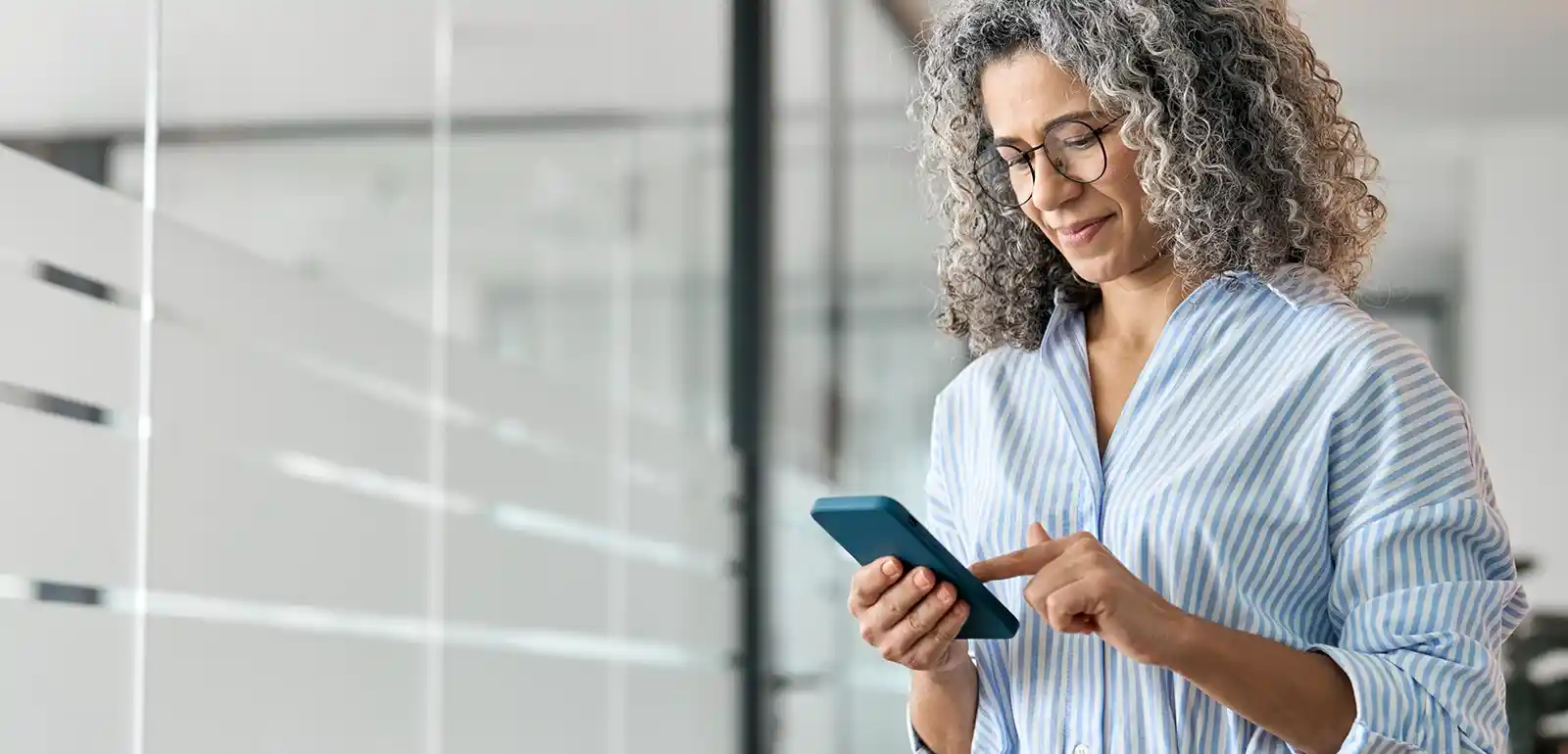 Business woman looking at improved call data after using fire damage local SEO services