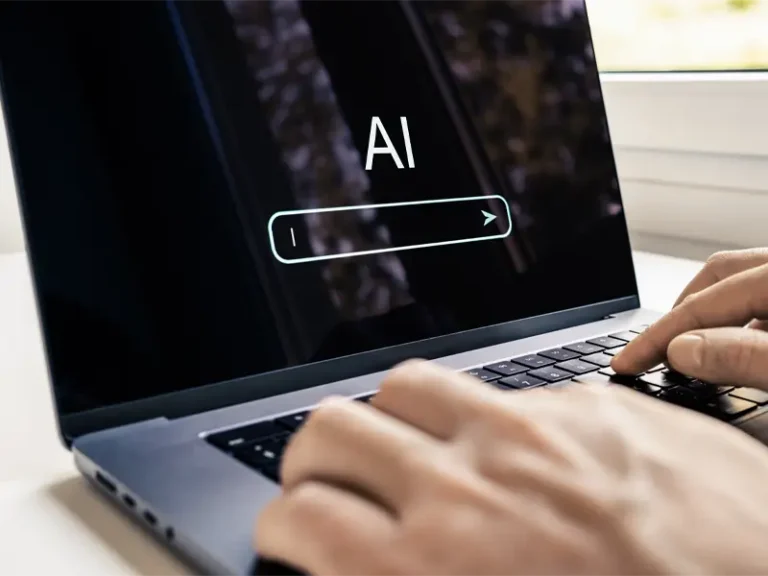 User chatting with AI on laptop and gets results based on who has the best AI SEO for restoration companies